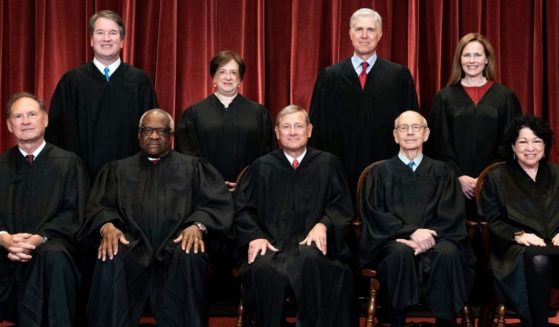 The Supreme Court justices -- seated from left: Associate Justice Samuel Alito, Associate Justice Clarence Thomas, Chief Justice John Roberts, Associate Justice Stephen Breyer and Associate Justice Sonia Sotomayor, and standing from left: Associate Justice Brett Kavanaugh, Associate Justice Elena Kagan, Associate Justice Neil Gorsuch and Associate Justice Amy Coney Barrett -- pose for a group photo at the Supreme Court in Washington on April 23.