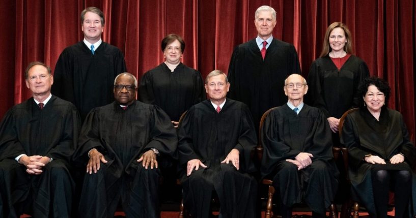 The Supreme Court justices -- seated from left: Associate Justice Samuel Alito, Associate Justice Clarence Thomas, Chief Justice John Roberts, Associate Justice Stephen Breyer and Associate Justice Sonia Sotomayor, and standing from left: Associate Justice Brett Kavanaugh, Associate Justice Elena Kagan, Associate Justice Neil Gorsuch and Associate Justice Amy Coney Barrett -- pose for a group photo at the Supreme Court in Washington on April 23.
