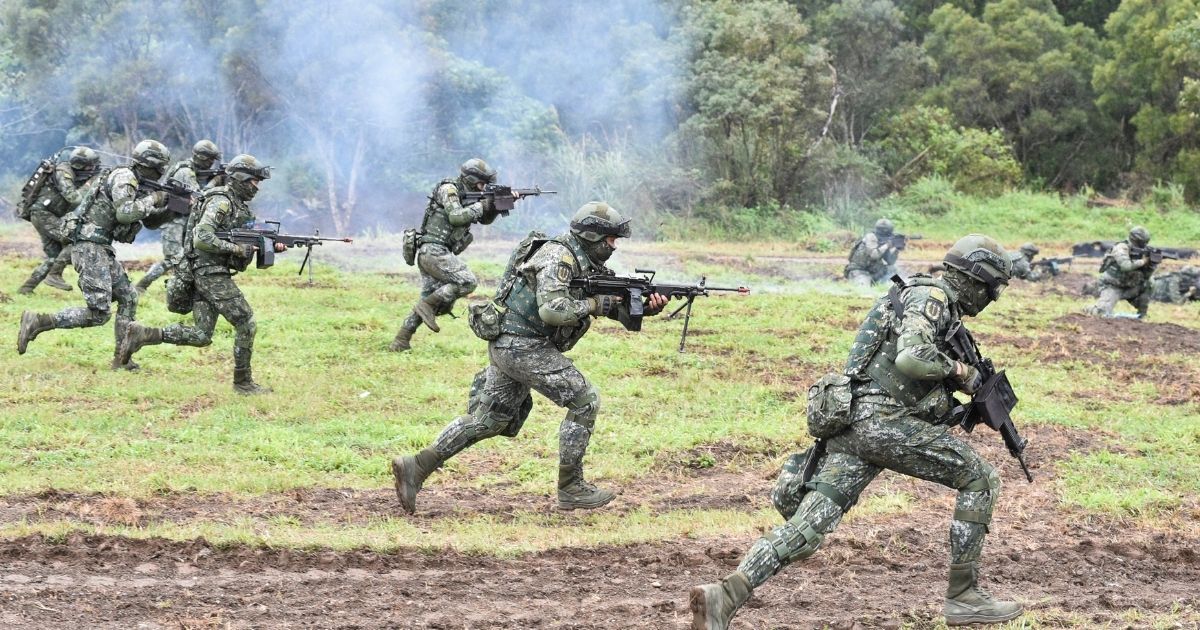 Taiwanese soldiers stage an attack during an annual drill at a military base in the eastern city of Hualien on Jan. 30, 2018.