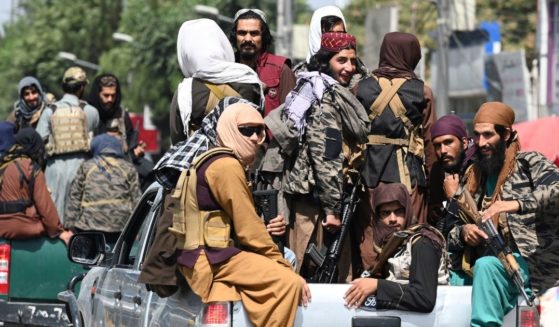 Taliban fighters patrol a street in Kabul on Thursday.