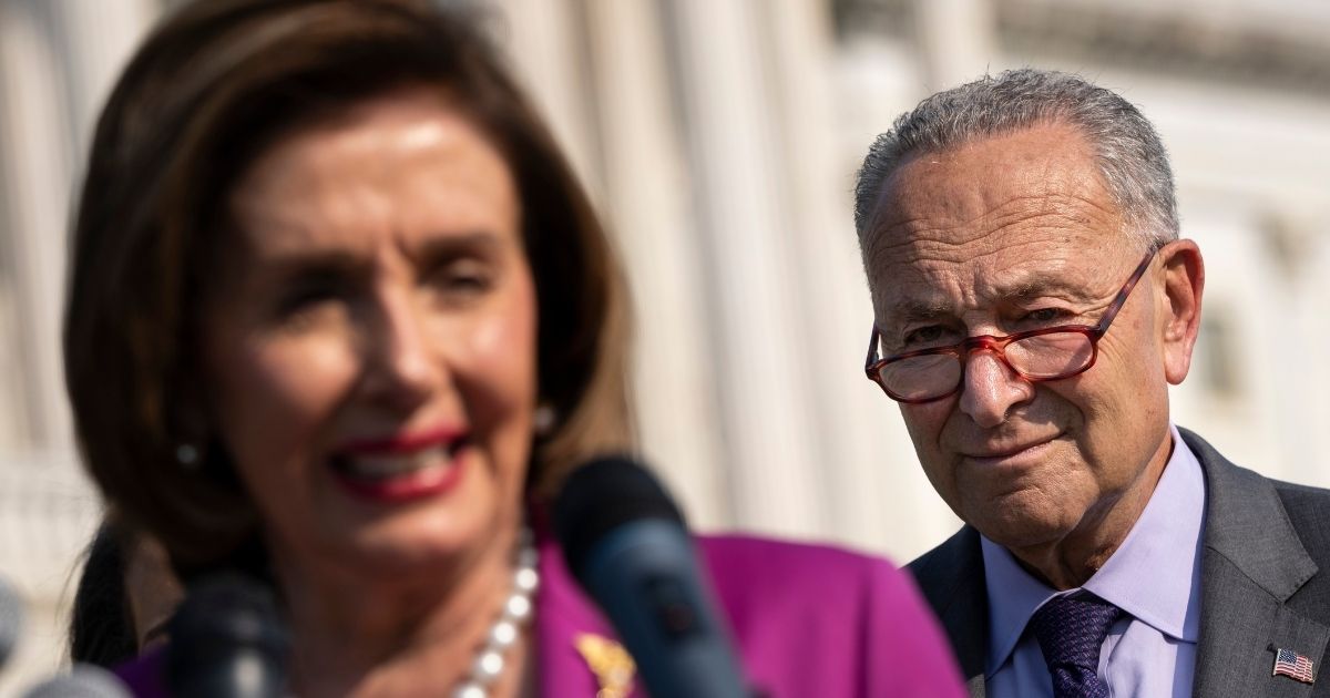 House Speaker Nancy Pelosi and Senate Majority Leader Chuck Schumer are seen at a news conference at the US Capitol in Washington, DC, on July 28.