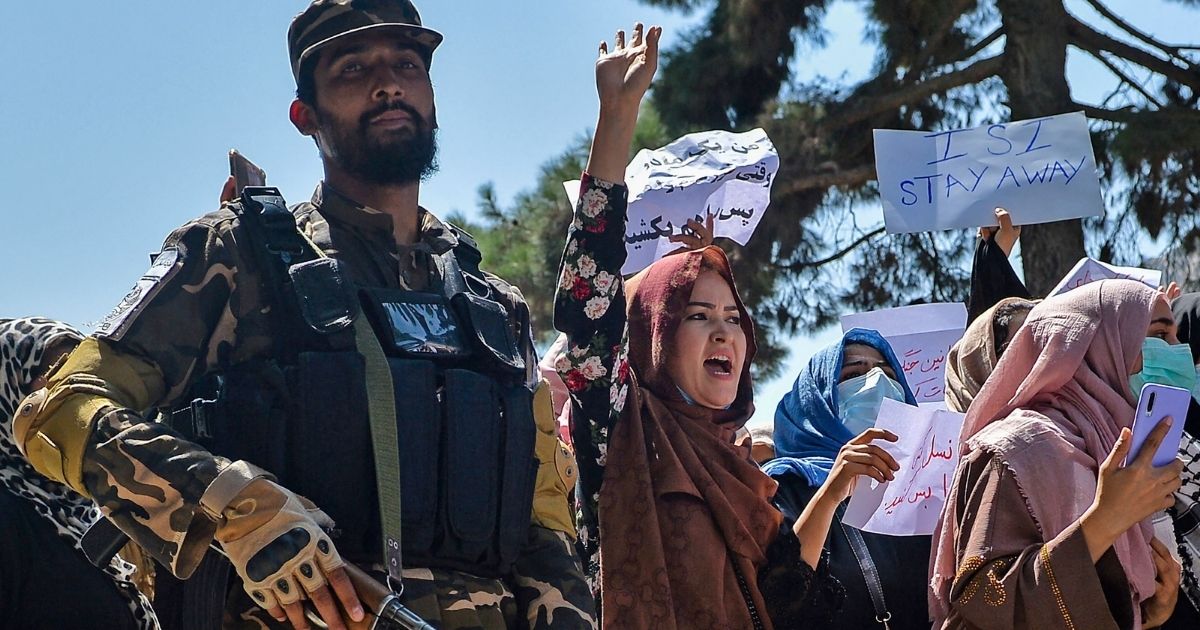 Afghan women are seen marching on Tuesday near the Pakistan embassy in Kabul.