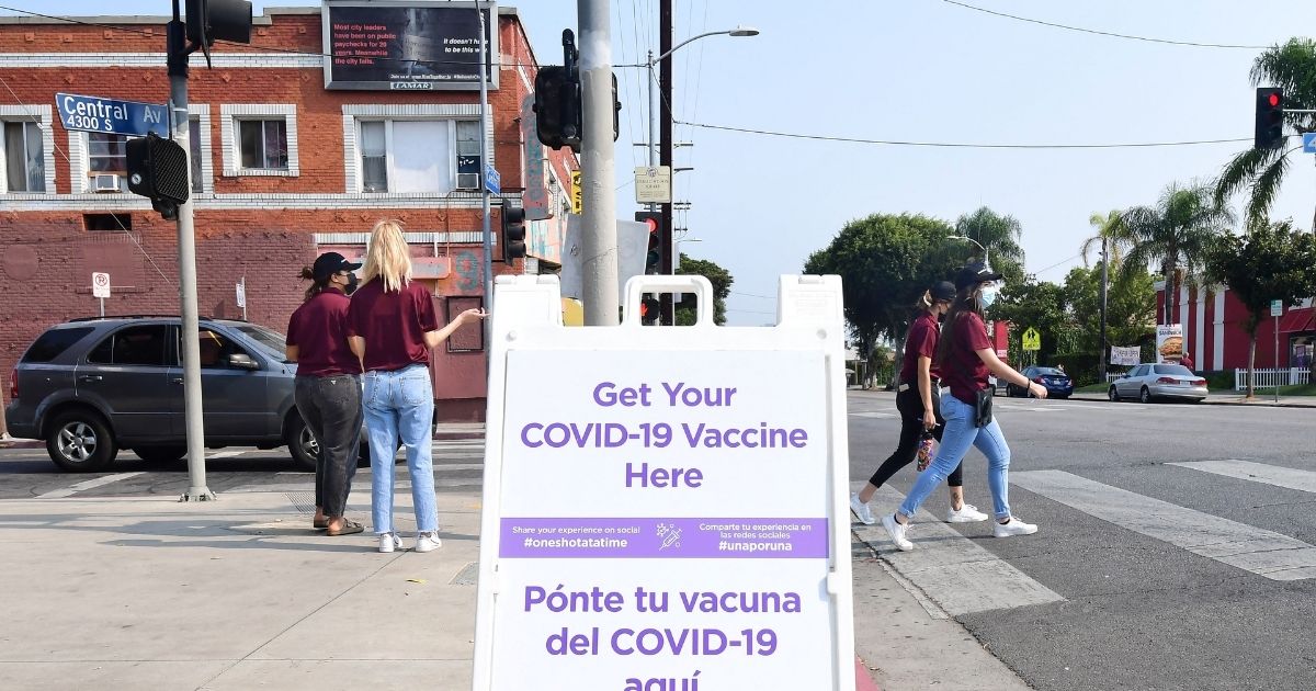 A sign containing information about where to obtain the COVID vaccine is seen on Aug. 17 in Los Angeles.
