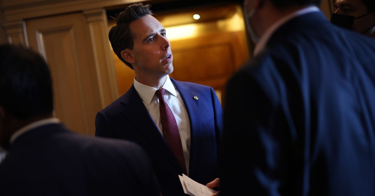 Sen. Josh Hawley is seen talking to reporters at the U.S. Capitol in Washington, D.C., on Tuesday.