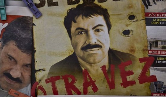 A poster of Mexican drug lord Joaquin "El Chapo" Guzman is seen in a Mexico City bus terminal on July 13, 2015.