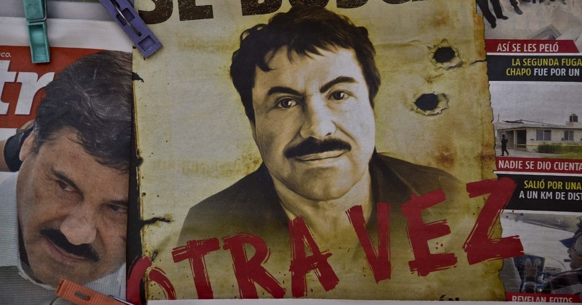 A poster of Mexican drug lord Joaquin "El Chapo" Guzman is seen in a Mexico City bus terminal on July 13, 2015.