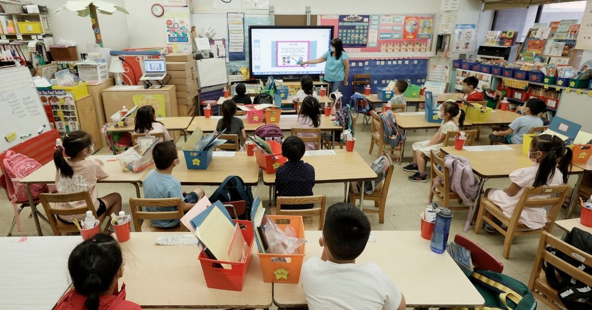 A teacher at Yung Wing P.S. 124 is seen teaching students on July 22, 2021, in New York City.