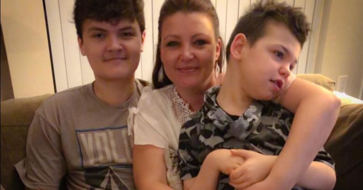 Tricia Proefrock holds her now-13-year-old son, Mason, in a photo from 2019. The two visited Disney World earlier this month.