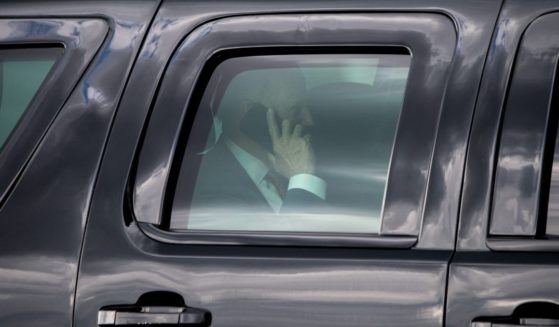 President Joe Biden speaks on his cellphone while traveling in an SUV on June 4, 2021. During a call with Chinese President Xi Jinping last week, Biden reportedly was rejected in his efforts to set up a face-to-face meeting.