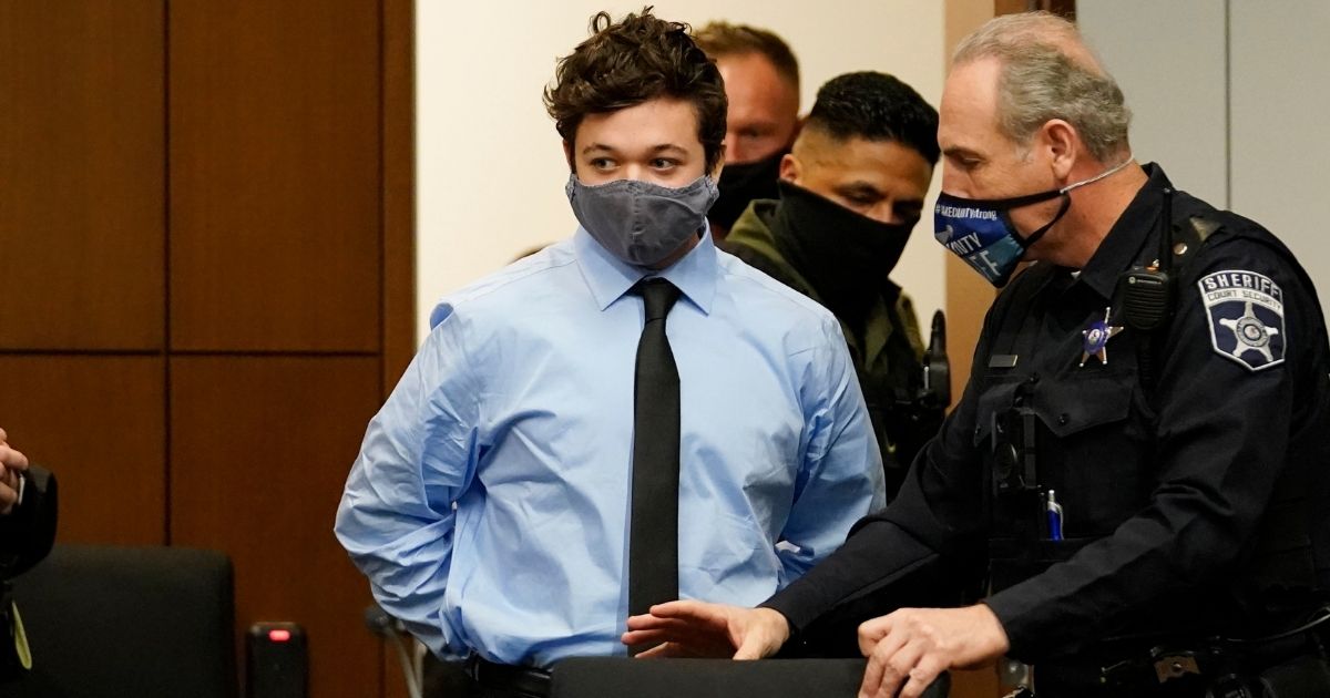 Kyle Rittenhouse, charged in the shooting deaths of two men and wounding a third during riots in Kenosha, Wisconsin, in August 2020, is pictured in a file photo from October of that year entering a courtroom.