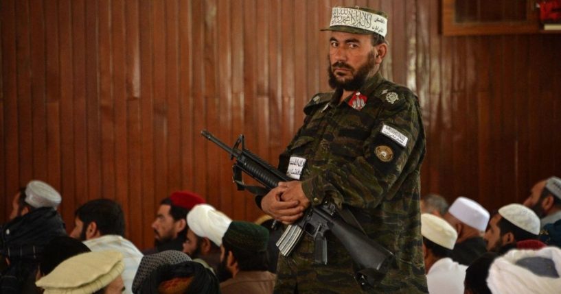 A Taliban fighter stands guard Friday during prayers at a Kabul, Afghanistan, mosque.