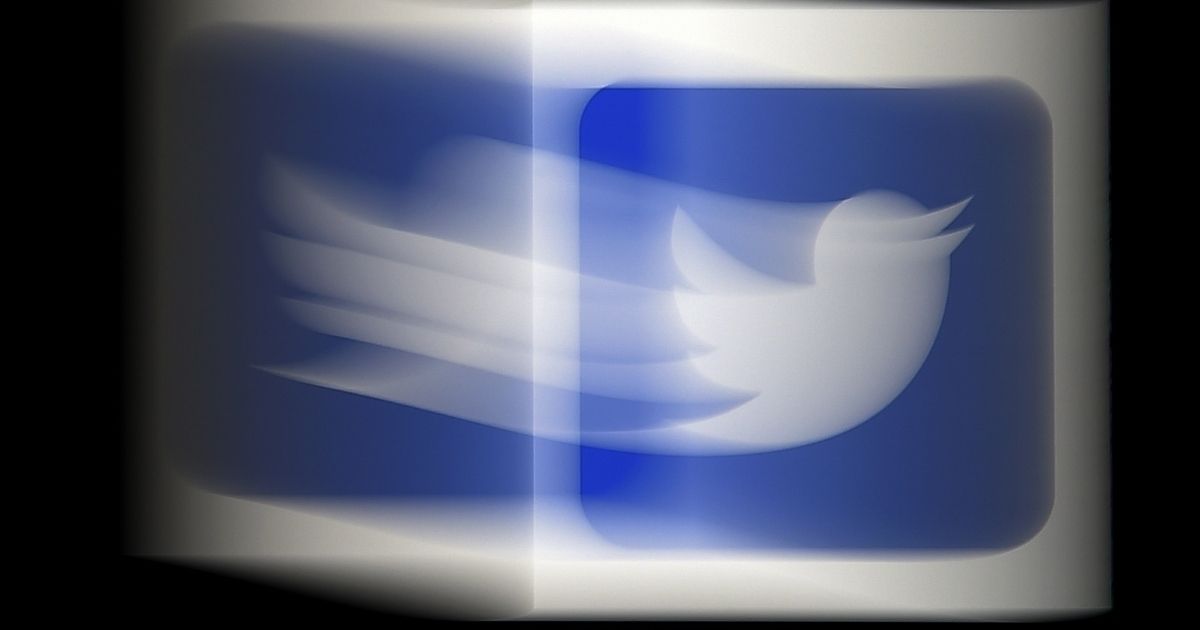 The Twitter logo can be seen on a mobile phone in Arlington, Virginia, on Aug. 10, 2020.