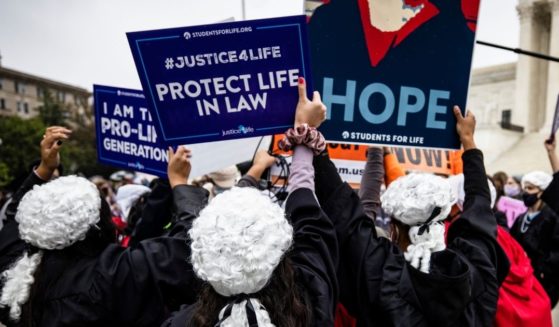 Supporters of Judge Amy Coney Barrett drown out pro-abortion demonstrators outside the U.S. Supreme Court in an Oct. 12, 2020 file photo.