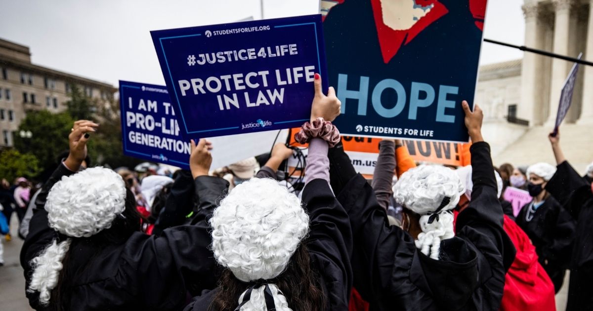 Supporters of Judge Amy Coney Barrett drown out pro-abortion demonstrators outside the U.S. Supreme Court in an Oct. 12, 2020 file photo.