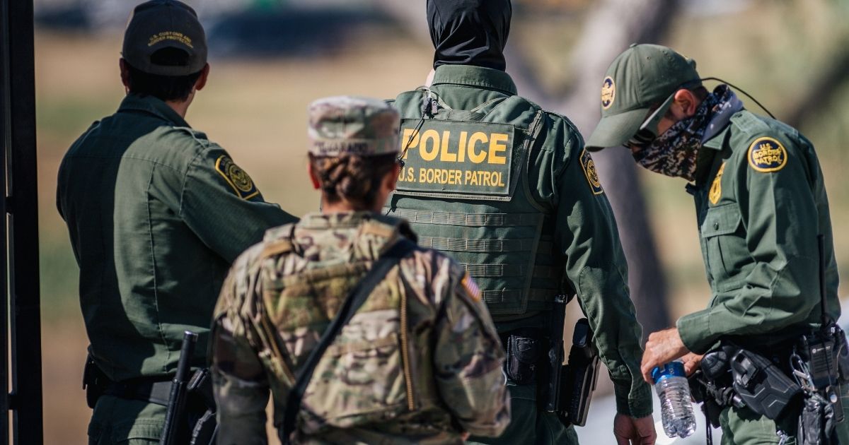 The Texas National Guard and Border Patrol staff a checkpoint entry near the Del Rio International Bridge last week in Del Rio, Texas.