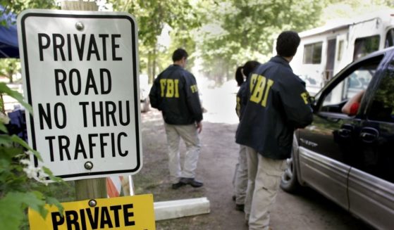 FBI agents are pictured in a 2006 file photo during a search in Milford, Michigan, for the remains of the union leader Jimmy Hoffa.