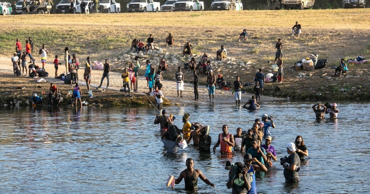A group of migrants and is seen in Del Rio, Texas, on Sept. 22, 2021.