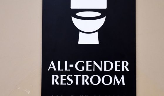 A sign for a gender-neutral restroom is seen at the Santee High School in Los Angeles on May 4, 2016.