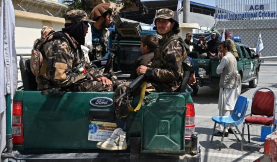 Taliban fighters patrol outside the Kabul International Cricket Stadium during the Twenty20 cricket trial match being played between the two Afghan teams 'Peace Defenders' and 'Peace Heroes' in Kabul on Sept. 3.