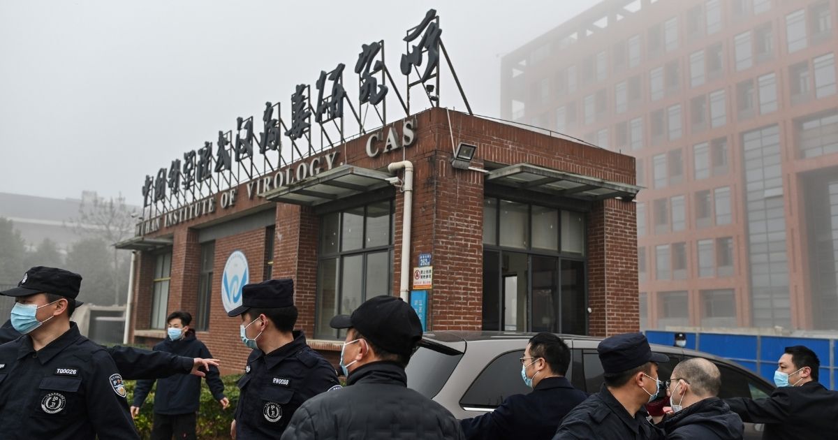 Members of the World Health Organization team investigating the origins of COVID-19 arrive at the Wuhan Institute of Virology in China's central Hubei province on Feb. 3.