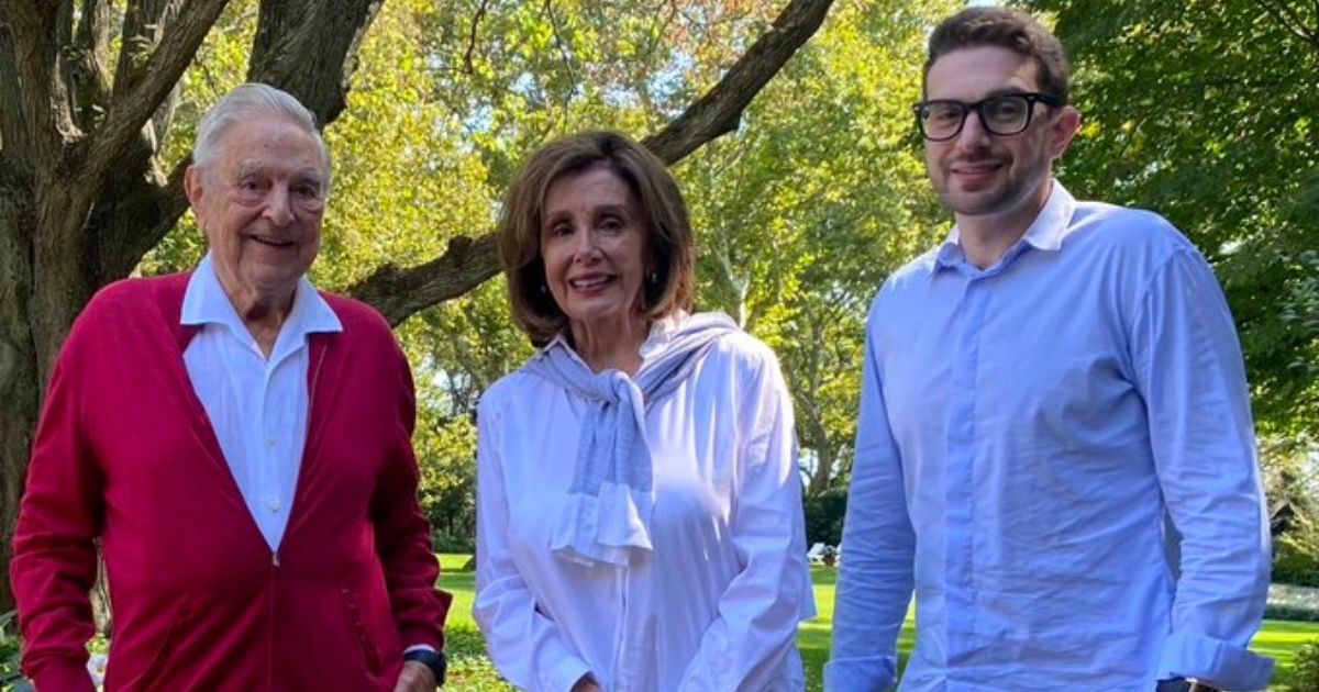 George Soros, left, poses with Nancy Pelosi and Anthony Soros in a photo released on Thursday.