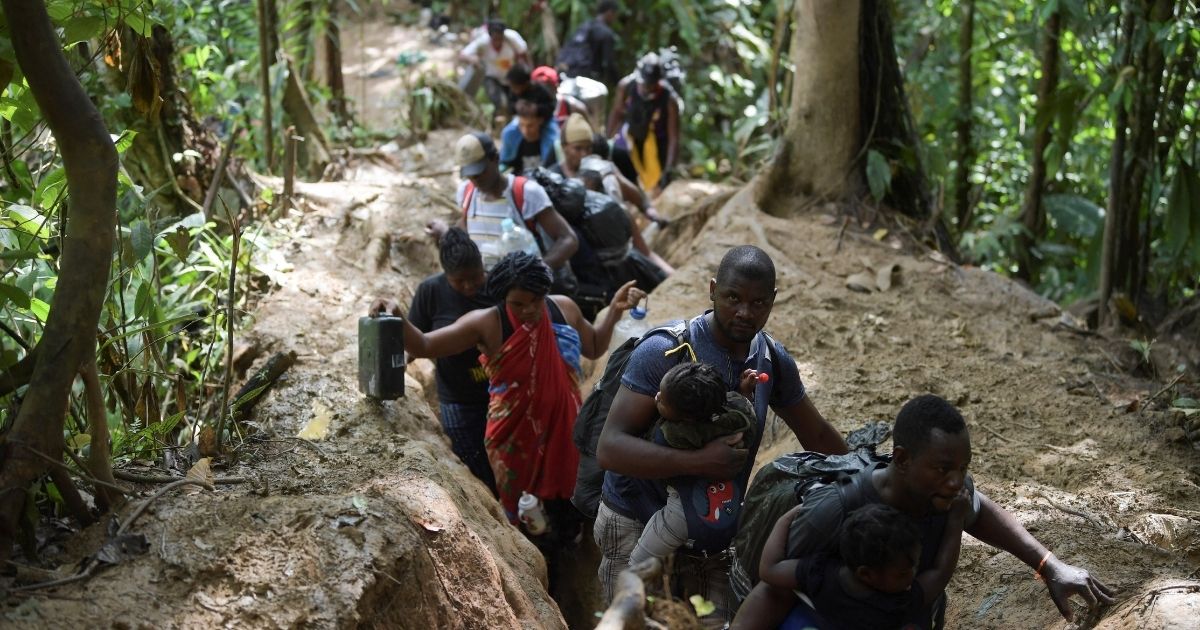 Haitian migrants cross the jungle of the Darien Gap, near Acandi, Choco department, Colombia, heading to Panama, on Sunday on their way trying to reach the U.S.