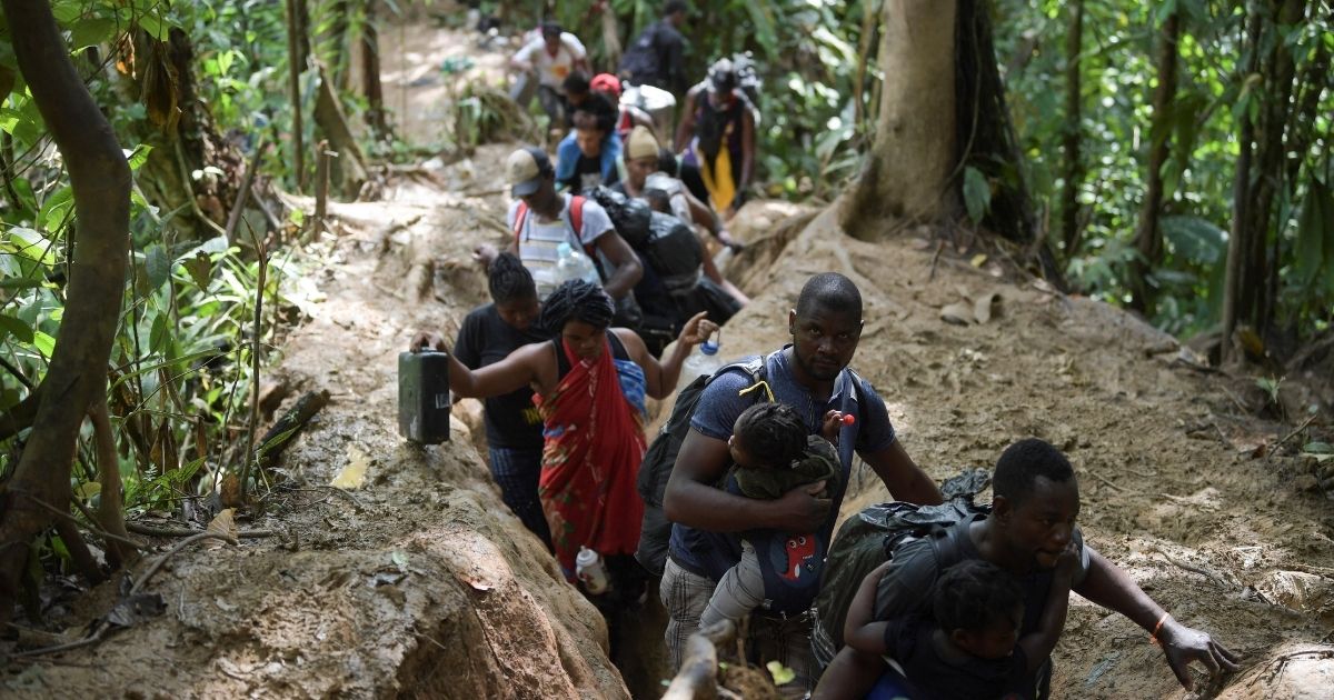 Haitian migrants cross the jungle of the Darien Gap, near Acandi, Choco department, Colombia, heading to Panama, on Sunday on their way trying to reach the U.S.