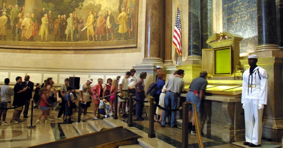 Visitors wait in line to view the original copies of the Declaration of Independence, the Constitution and the Bill of Rights July 4, 2001, at the National Archives in Washington, D.C.