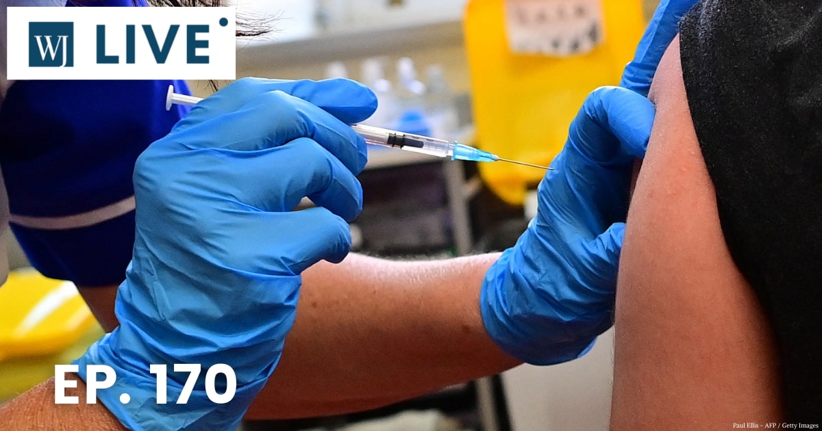 A person receives a dose of the Pfizer-BioNtech vaccine in Derby, England, on Monday.