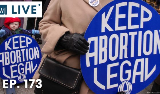 Pro-abortion activists are seen at a protest in the image above.