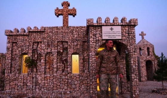 In this photograph taken on Nov. 27, 2019, a Georgian soldier leaves a church after praying at the NATO military base Camp Marmal on the outskirts of Mazar-i-Sharif, Afghanistan.