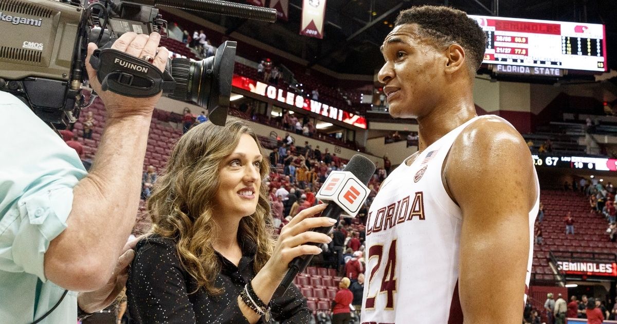 Allison Williams is seen interviewing Devin Vassell of the Florida State Seminoles in this file photo from February 2020. Williams left ESPN last week over the media company's vaccine mandate. Now she has been hired to do a sports show for The Daily Wire.