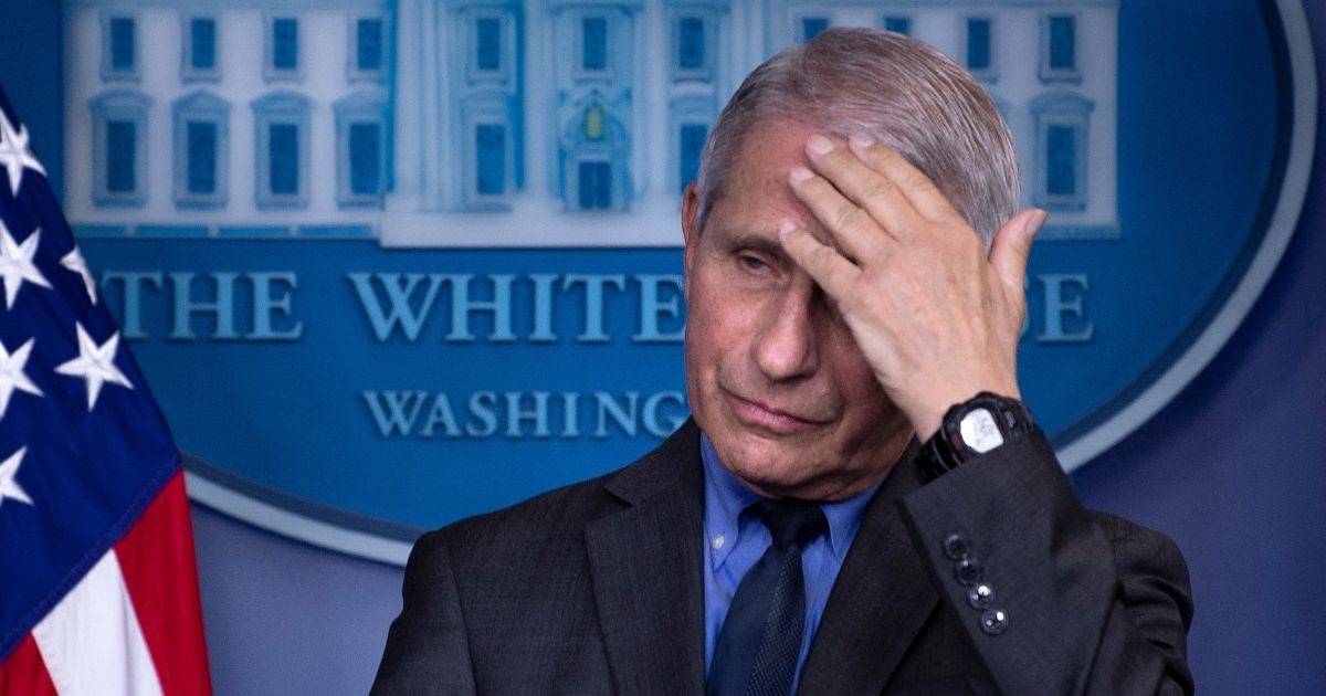 Dr. Anthony Fauci, director of the National Institute of Allergy and Infectious Diseases, listens to a question regarding a pause in the issuing of the Johnson & Johnson COVID-19 vaccine during a media briefing at the White House on April 13 in Washington, D.C.