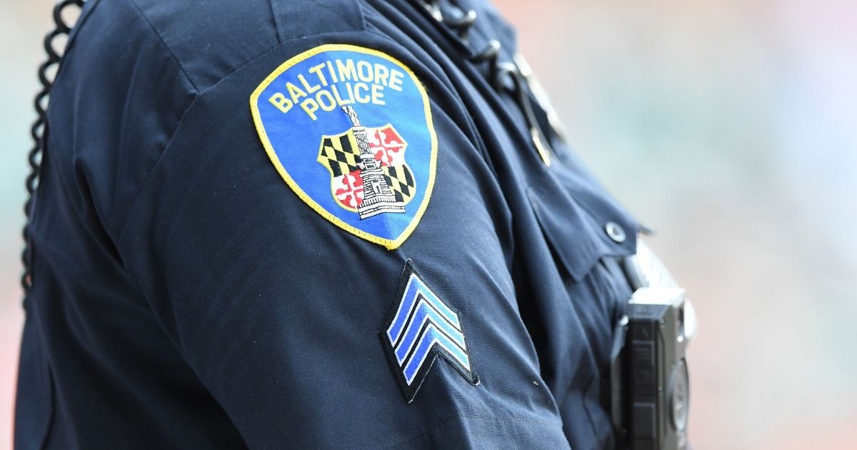 A Baltimore policeman looks on during a baseball game between the Baltimore Orioles and the Washington Nationals at Camden Yards on July 24 in Baltimore.