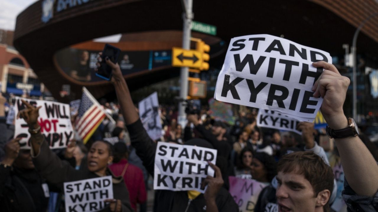 Protesters rallying against COVID-19 vaccination mandates and in support of basketball player Kyrie Irving gather in the street outside the Barclays Center before an NBA basketball game between the Brooklyn Nets and the Charlotte Hornets, Sunday, Oct. 24, 2021, in New York.