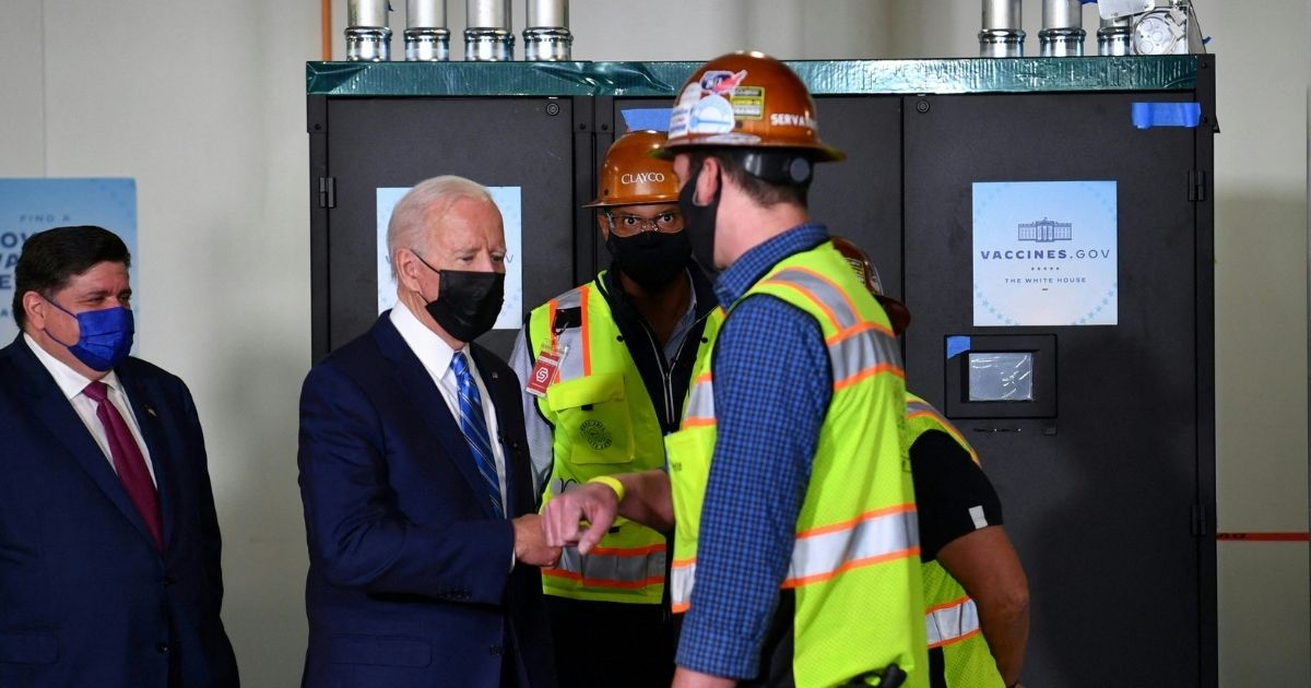 President Joe Biden tours the Clayco construction site in Elk Grove Village, Illinois, on Oct. 7, 2021.