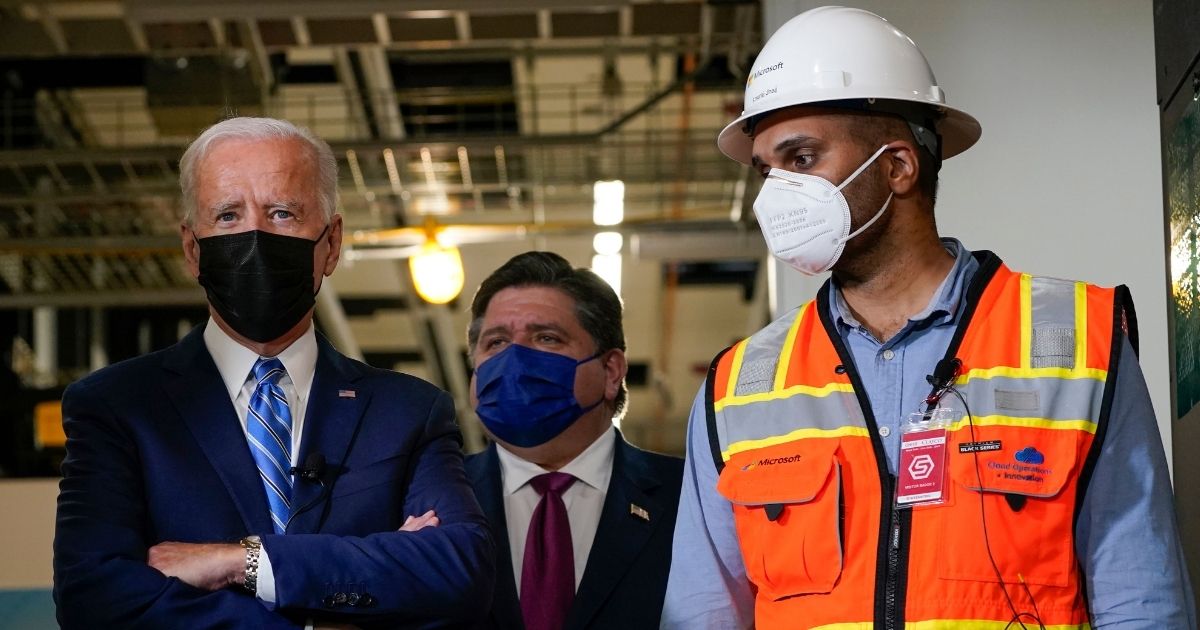 President Joe Biden tours a Clayco construction site for a Microsoft data center in Elk Grove Village, Ill., Thursday with Illinois Gov. J.B. Pritzker, center, and Anuraj Jhajj. Clayco is owned by a major Biden campaign contributor.