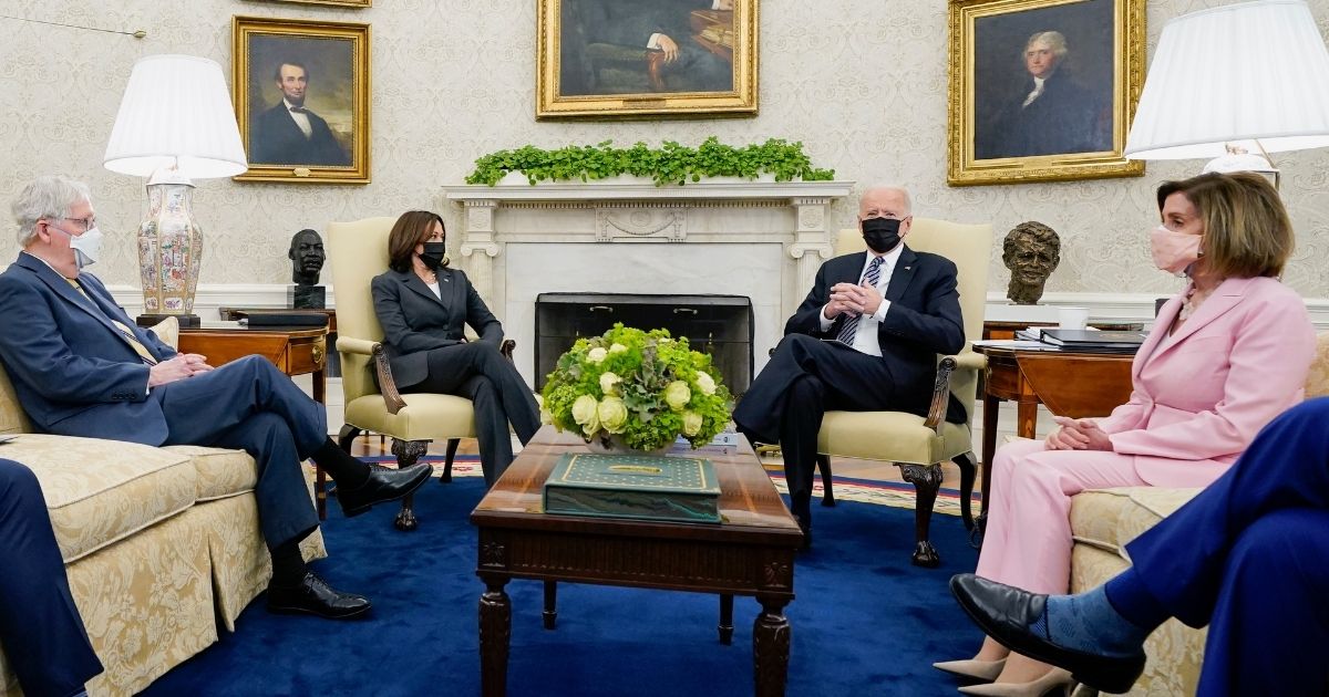 From left to right, Senate Minority Leader Mitch McConnell, Vice President Kamala Harris, President Joe Biden, and House Speaker Nancy Pelosi meet in the Oval Office on May 12.