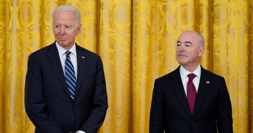President Joe Biden and Secretary of Homeland Security Alejandro Mayorkas attend a naturalization ceremony in the East Room of the White House on July 2, 2021, in Washington.