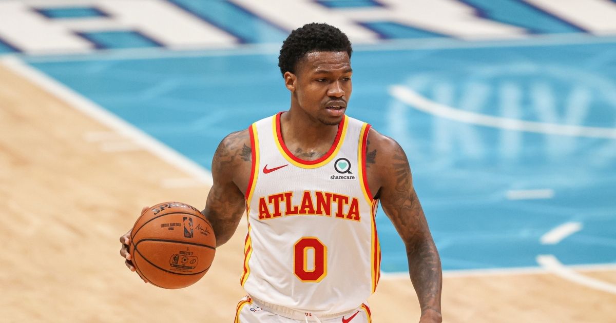 Atlanta Hawks guard Brandon Goodwin brings the ball up court against the Charlotte Hornets in the first half of an NBA basketball game in Charlotte, North Carolina, on April 11, 2021.