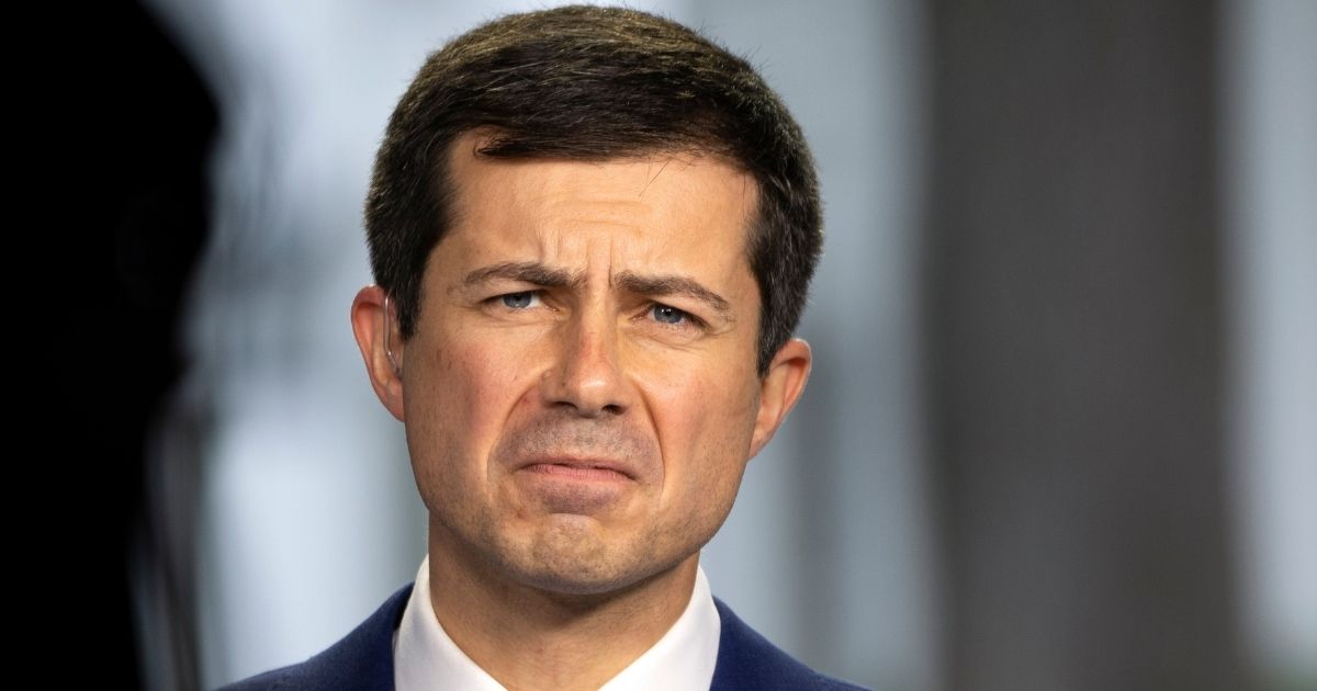 U.S. Transportation Secretary Pete Buttigieg, seen in an Oct. 13 TV interview, does not understand why anyone would object to his taking months of paid paternity leave while the nation is gripped by a transportation crisis.