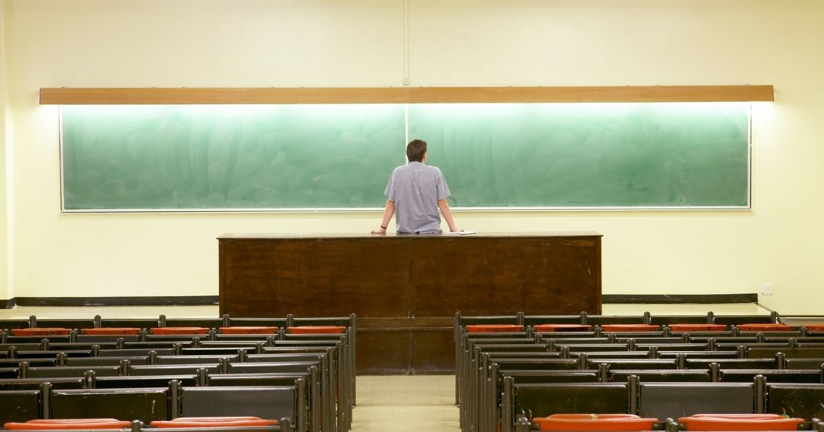 This stock image shows a man standing in front of a blank chalkboard in a classroom. Republican members of the House Judiciary Committee on Wednesday announced they will investigate potential collusion between the Biden administration and the National School Boards Association.