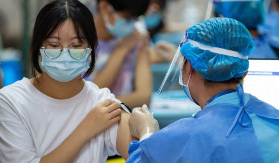 This photo taken on Aug. 21, 2021, shows a high school student receiving the Sinovac COVID-19 vaccine in Nanjing in China's eastern Jiangsu province.