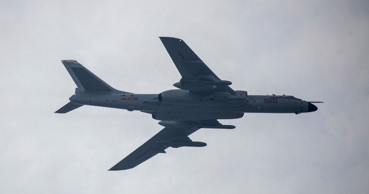 A Chinese H-6 bomber jet is seen flying over Beijing in Sept. 2019.