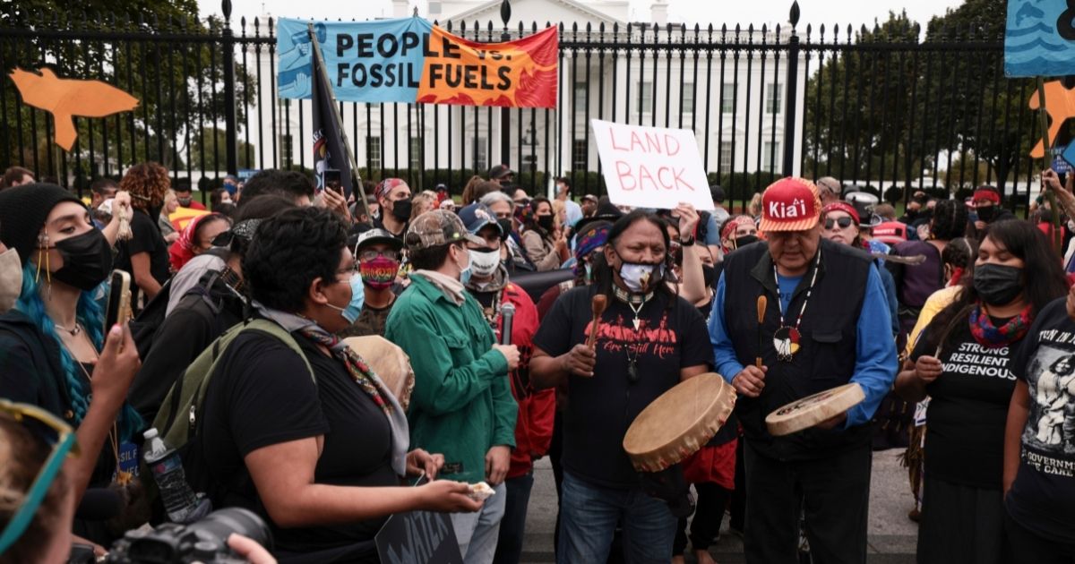 Left-wing agitators participate in a "climate march" outside the White House on Monday in Washington, D.C.