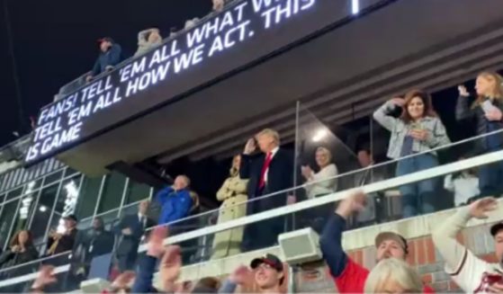 Former President Donald Trump and Melania Trump attend the Atlanta Braves' game on Saturday.