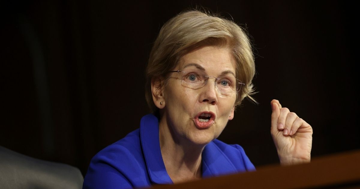 Democratic Sen. Elizabeth Warren of Massachusetts questions Treasury Secretary Janet Yellen and Federal Reserve Chairman Jerome Powell during a Senate Banking, Housing, and Urban Affairs Committee hearing on Sept. 28 in Washington, D.C.