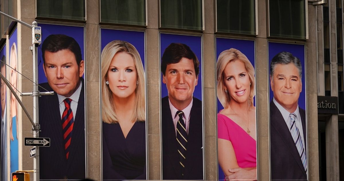 Advertisements featuring Fox News personalities, including Bret Baier, Martha MacCallum, Tucker Carlson, Laura Ingraham and Sean Hannity, adorn the front of the News Corporation building on March 13, 2019 in New York City.