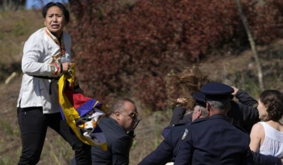 On Monday, Free Tibet activists were escorted away from the Olympic torch lighting ceremony for peacefully protesting China's hosting of the Winter Olympics.