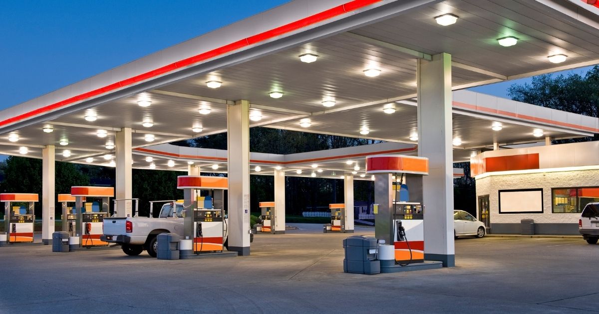 A gas station is seen at night in the stock image above.